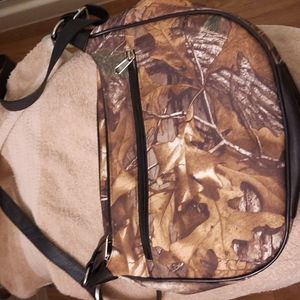 Larger cross body purse.  8 zippers.  Stay organized  never used, new!